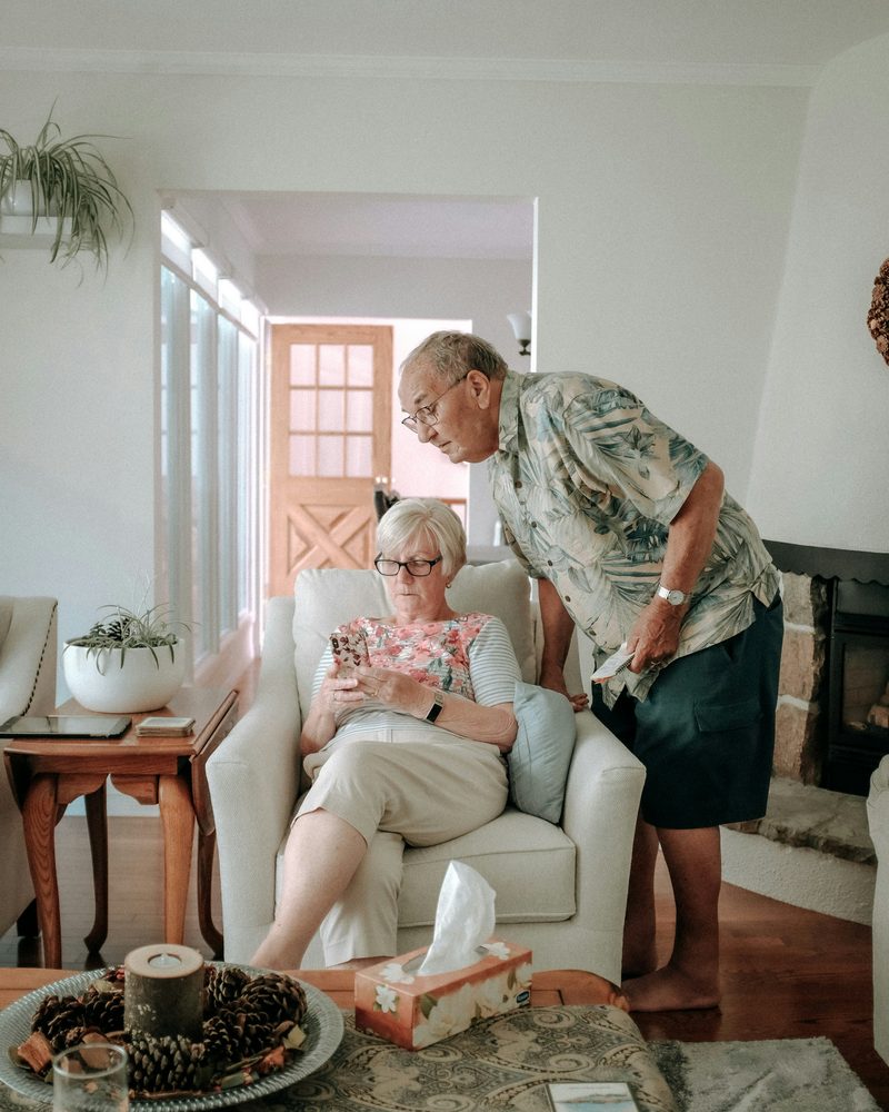 An older couple relaxing together in their living room